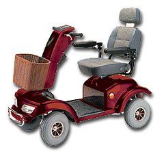 Burgundy mobility scooter with a basket, gray seat, and large wheels.