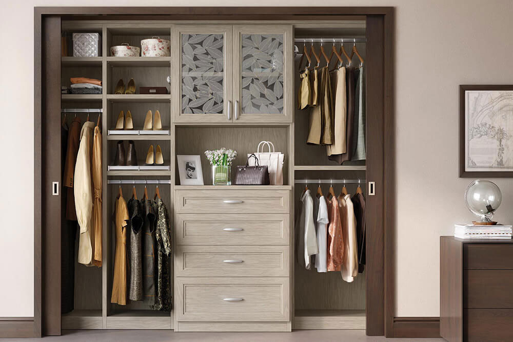 a closet filled with clothes and a dresser