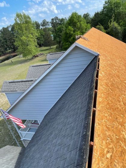 An aerial view of a house with a roof that is being built.