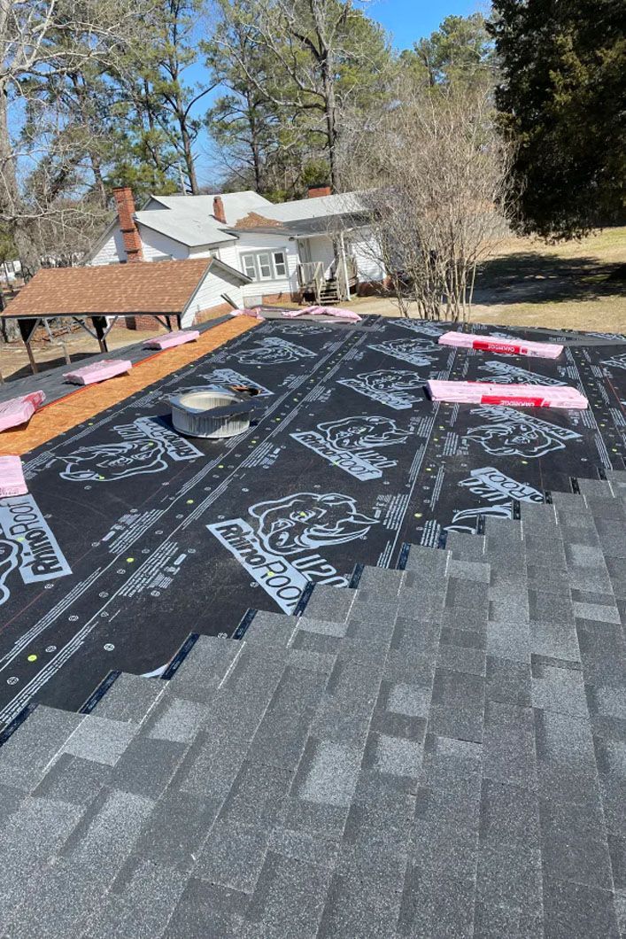A roof is being installed on a house.