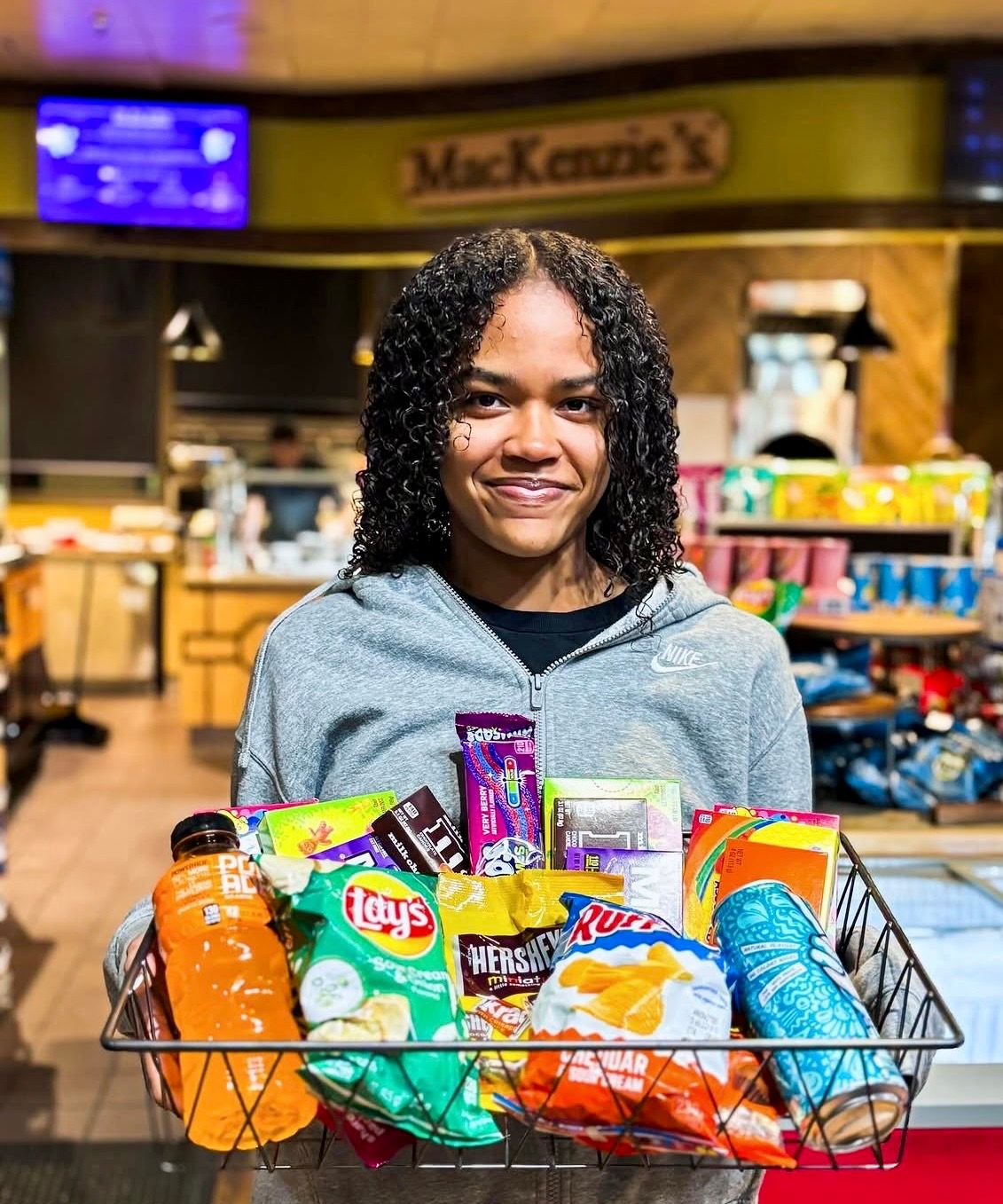 A large group of people are posing for a picture in a room.