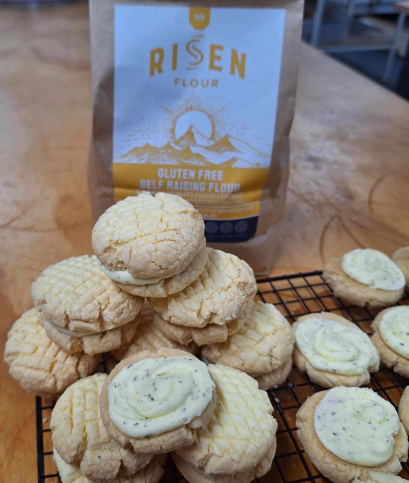 melting moment biscuits sandwiched together with gluten free flour product bag in background