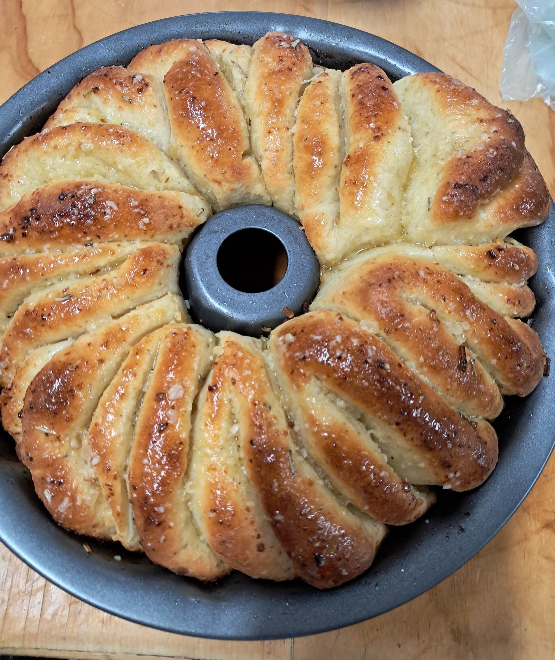 layers of garlic bread smothered in butter in a round tin