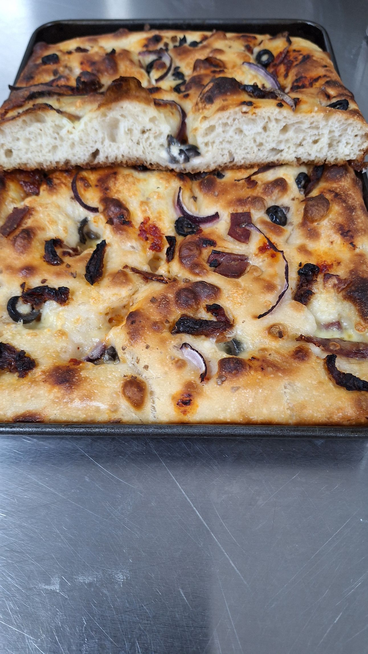 soft cheesy focaccia with olives and sundried tomatos