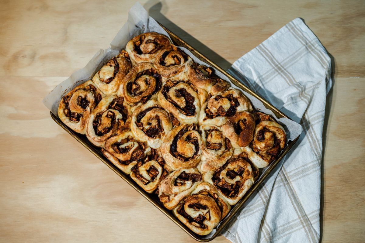 demonstrating how to apply sauce