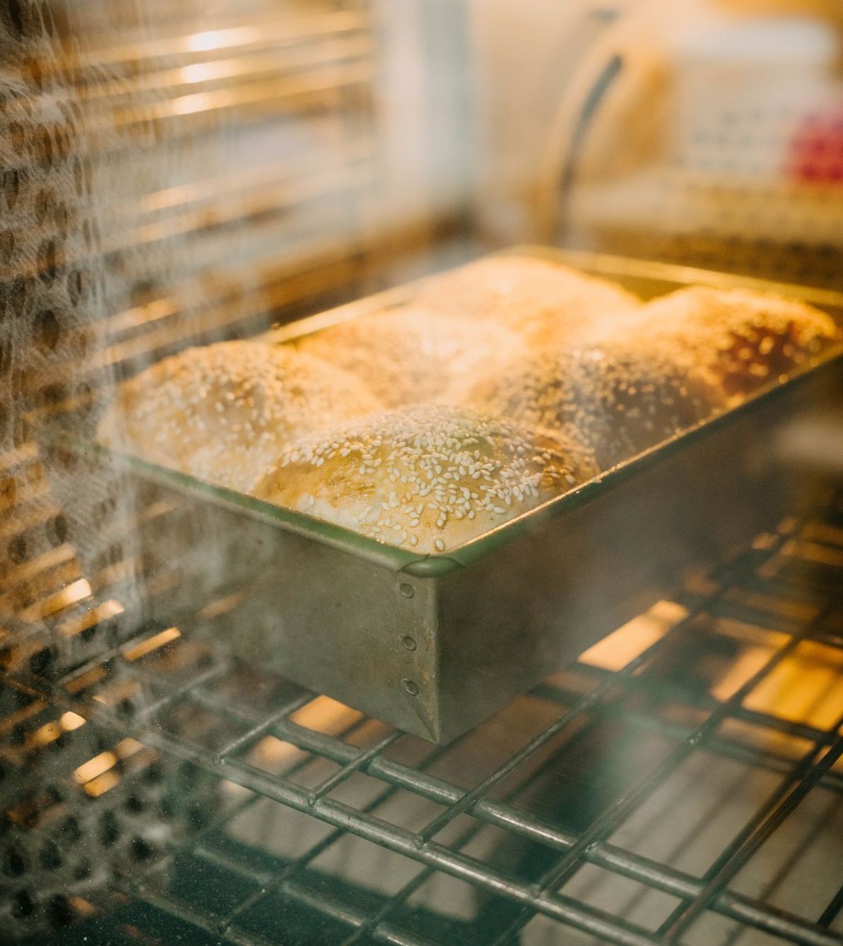 Lady watching man knead dough