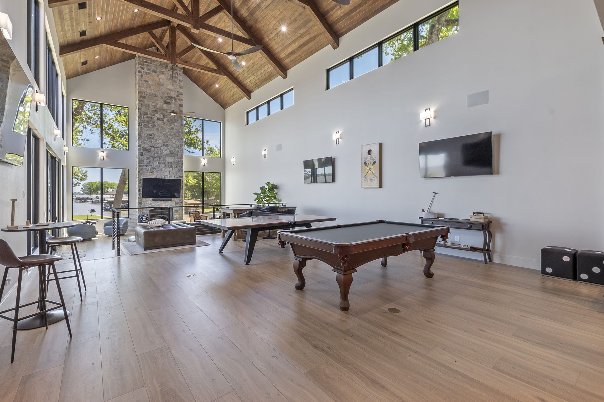 There is a pool table in the middle of the room.