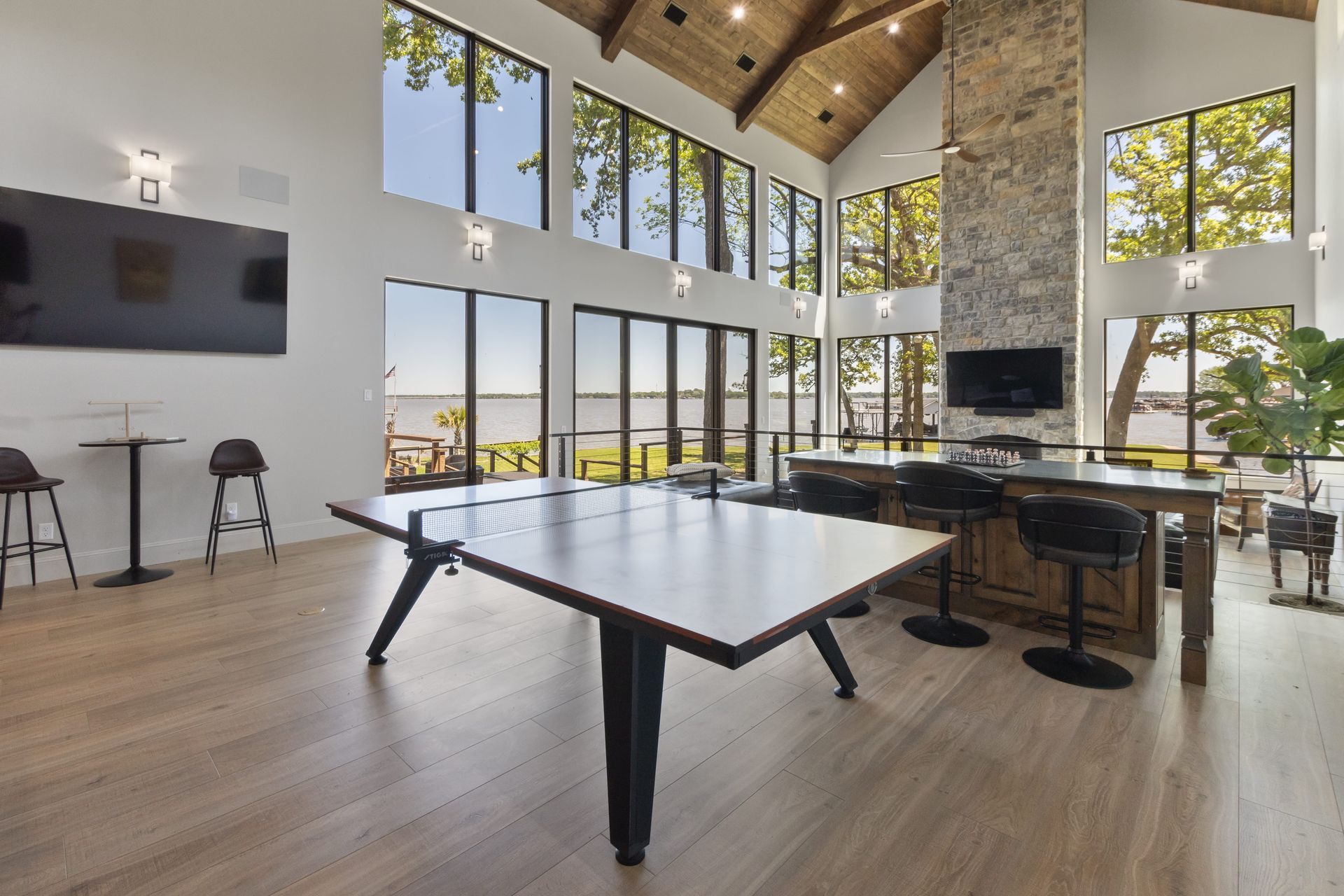 There is a ping pong table in the middle of the room.