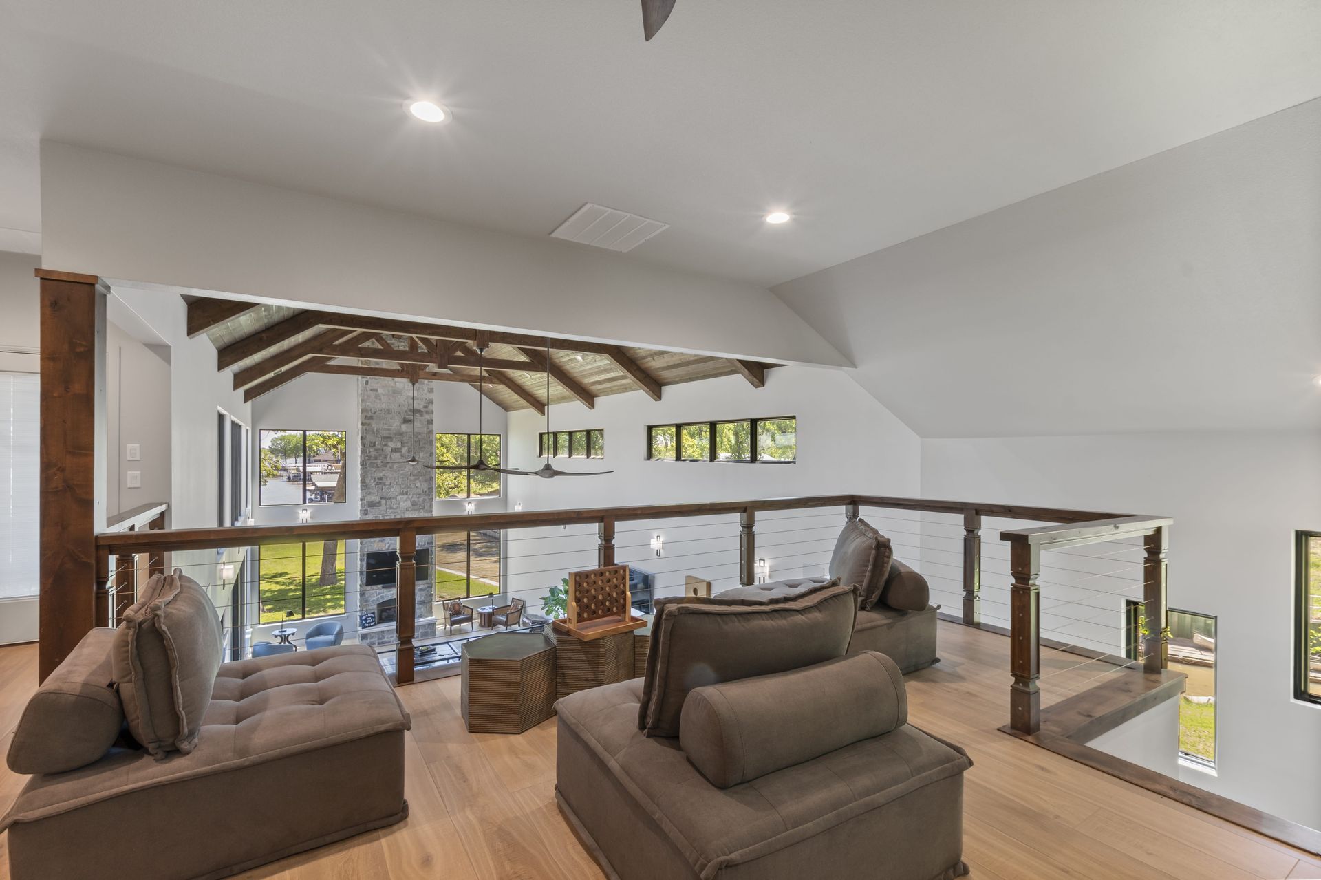 A living room with lots of furniture and a balcony.
