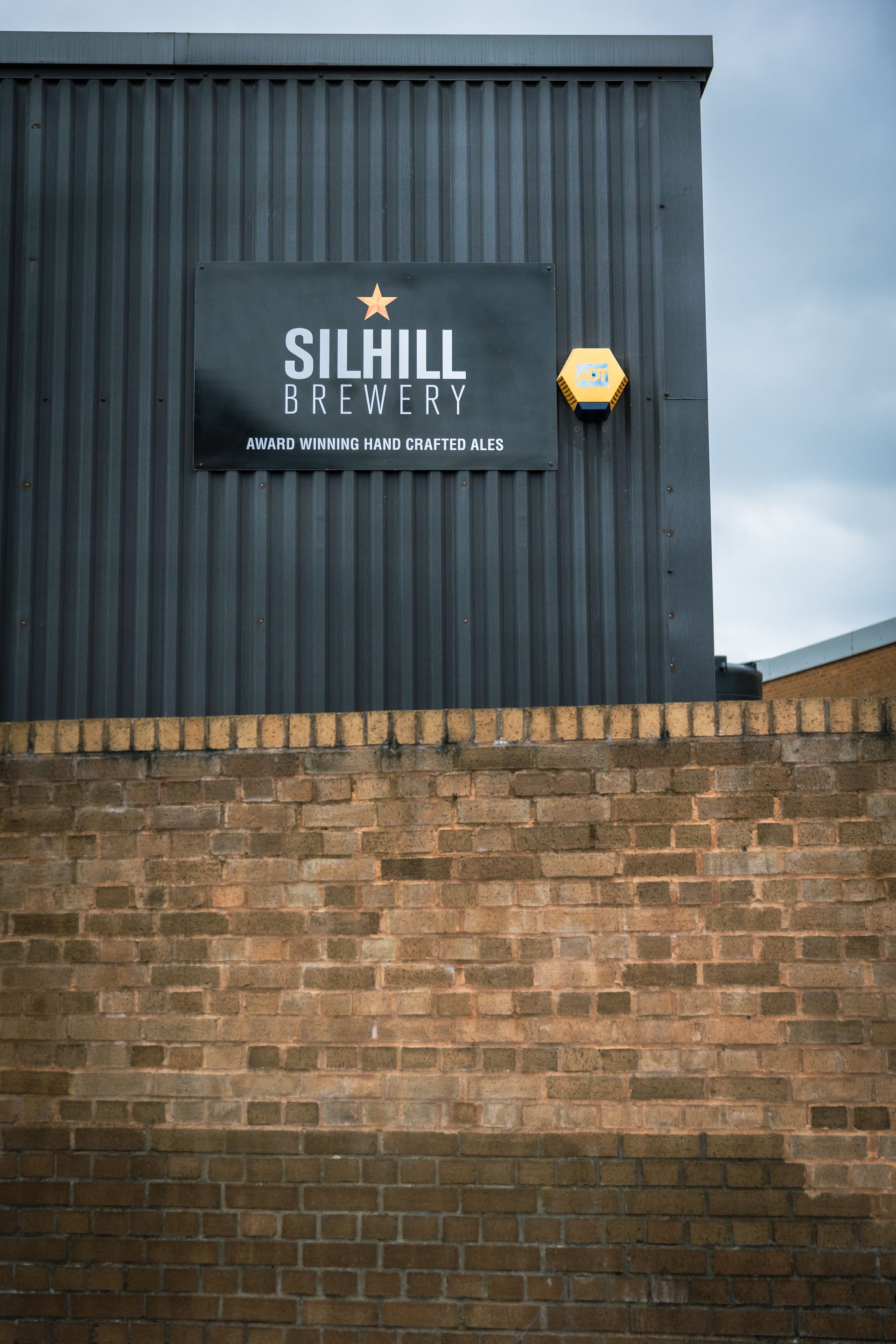A sign on the side of a building that says silhill brewery