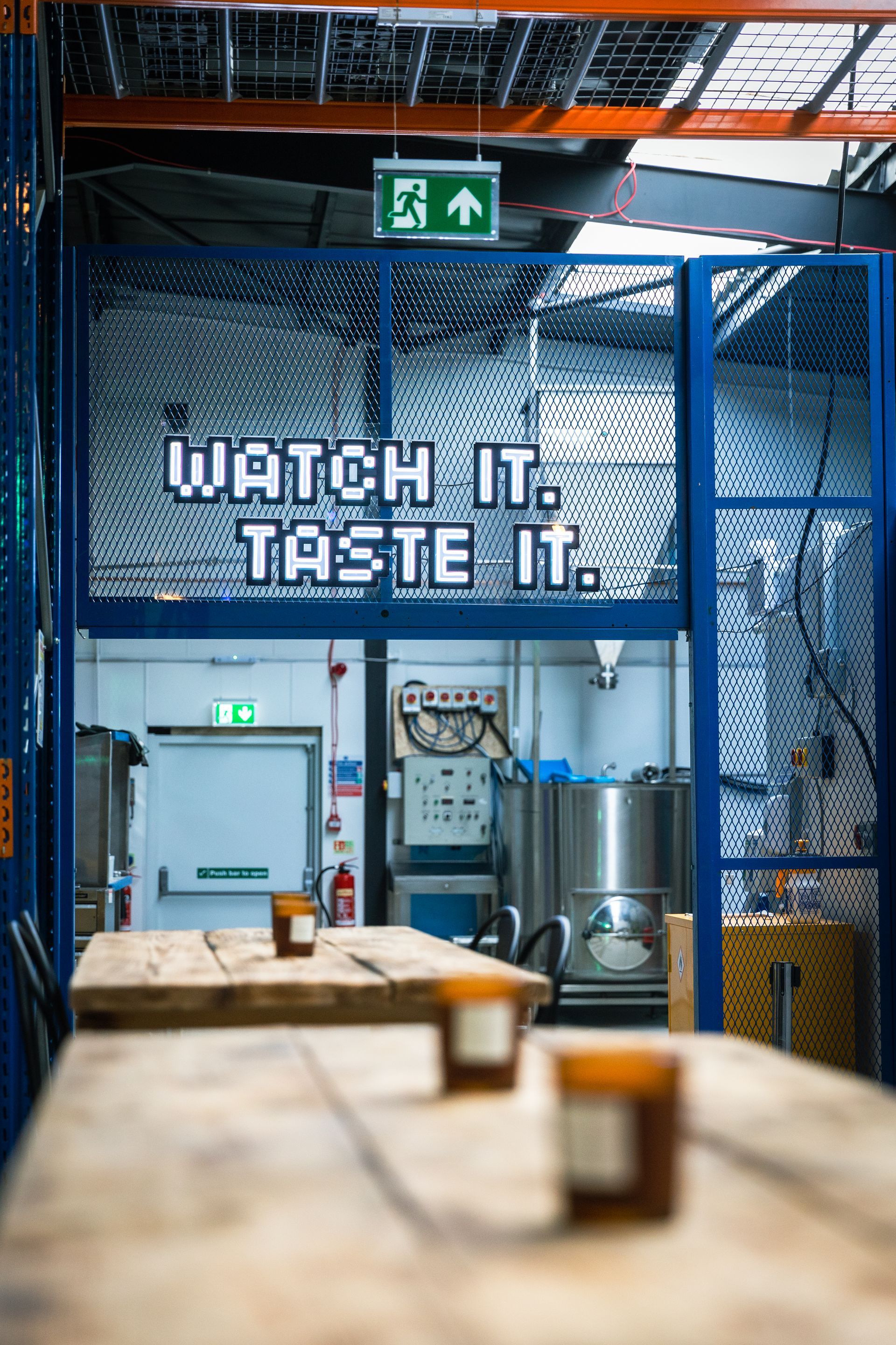 A warehouse with a sign that says watch it taste it
