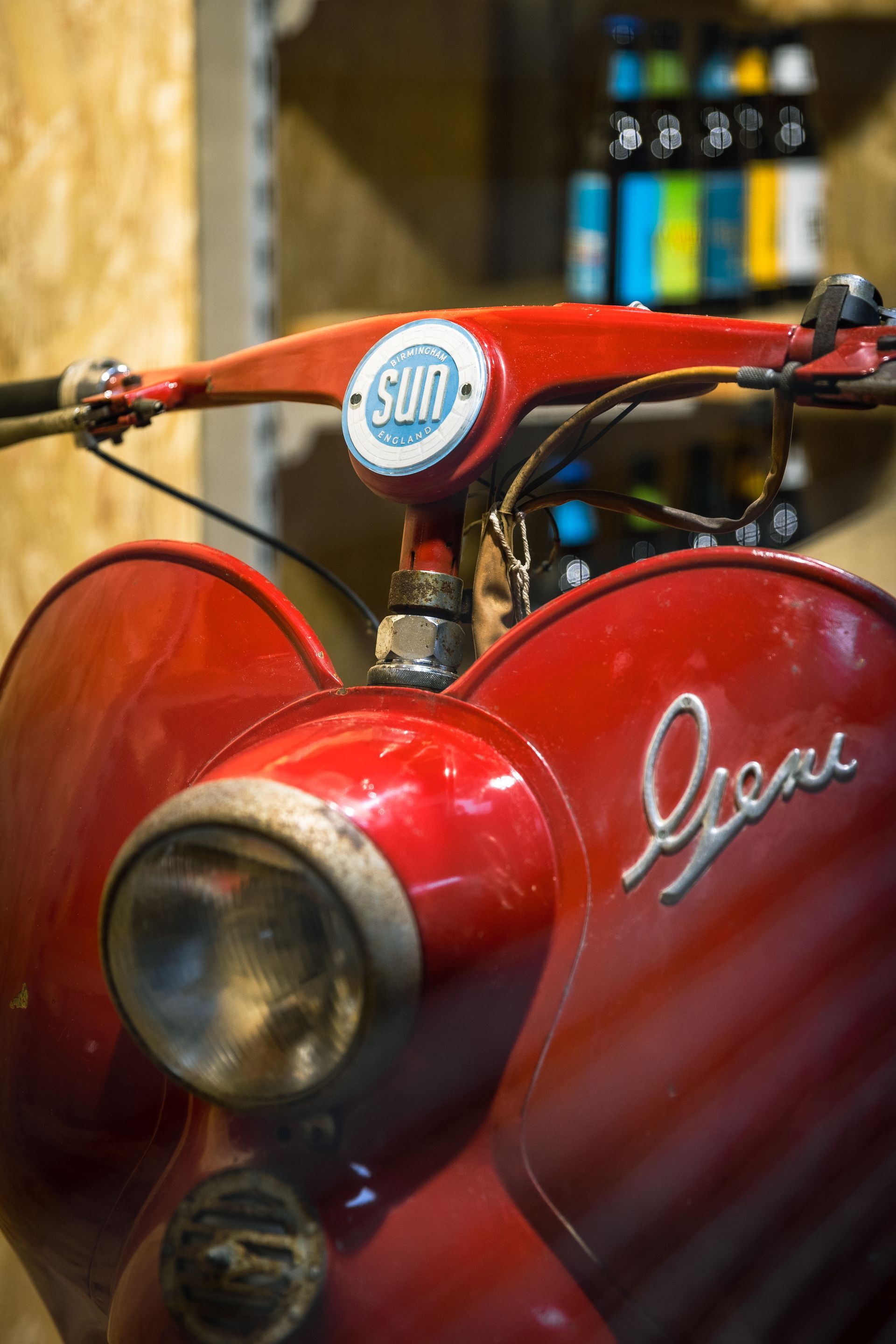A red scooter with the word gene on it