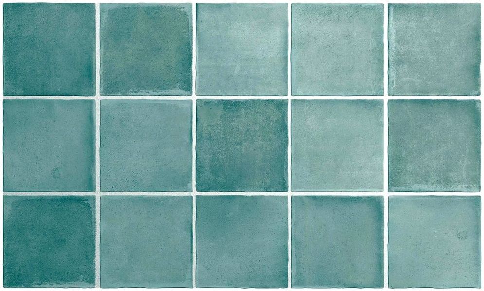 A close up of a row of green tiles on a white background.