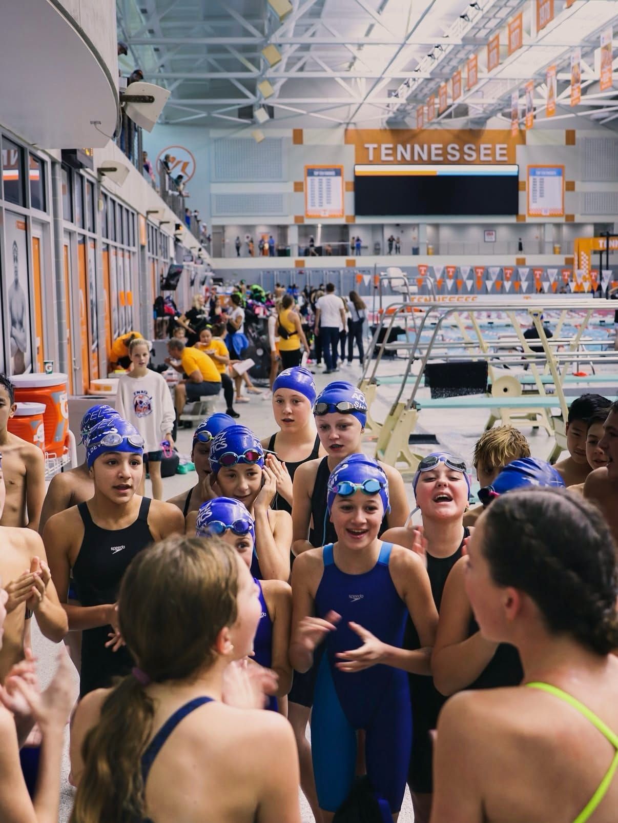 A group of Excel athletes cheering before a meet at the University of Tennessee.
