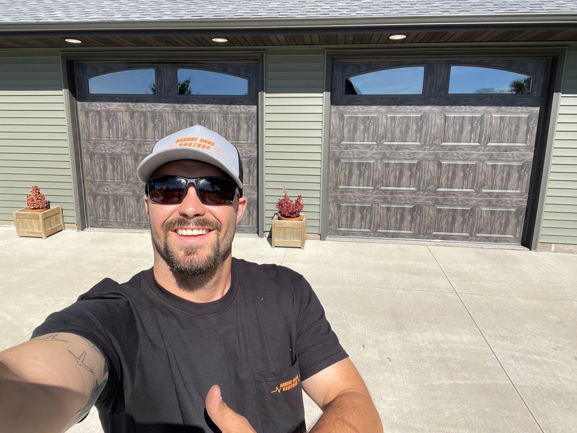 A truck is parked in front of a garage under construction.