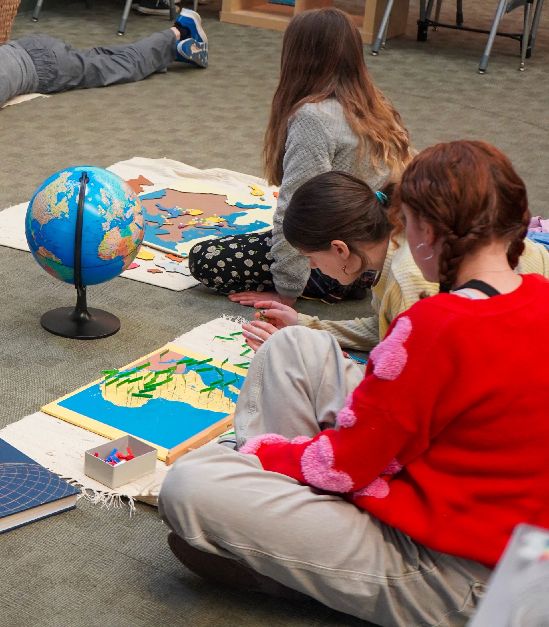 Two Upper Elementary students work together to label capitols of the countries in South America.