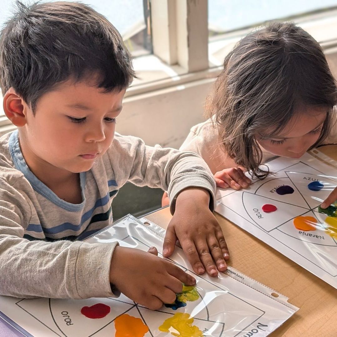 Two Kindergarten Bridge students practice their Spanish vocabulary of colors with a fun, interactive project.