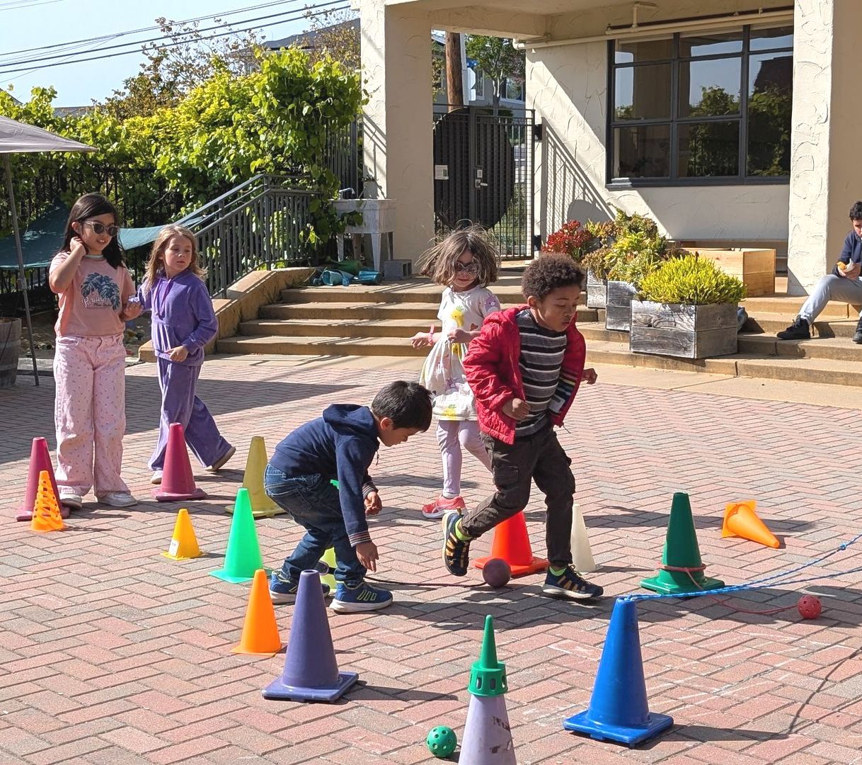 A group of students enjoy a self-made obstacle course during the Afterschool Program.
