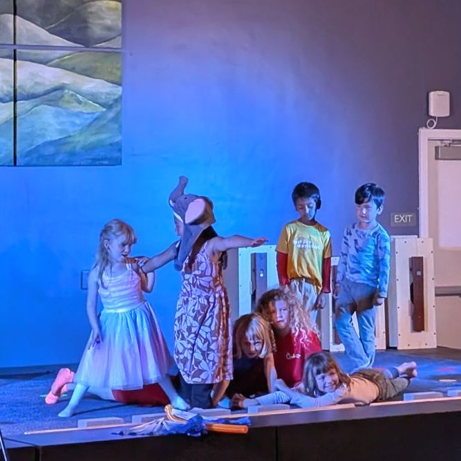 Kindergarten students perform a dance and song on stage as part of our Orff Spring Concert.