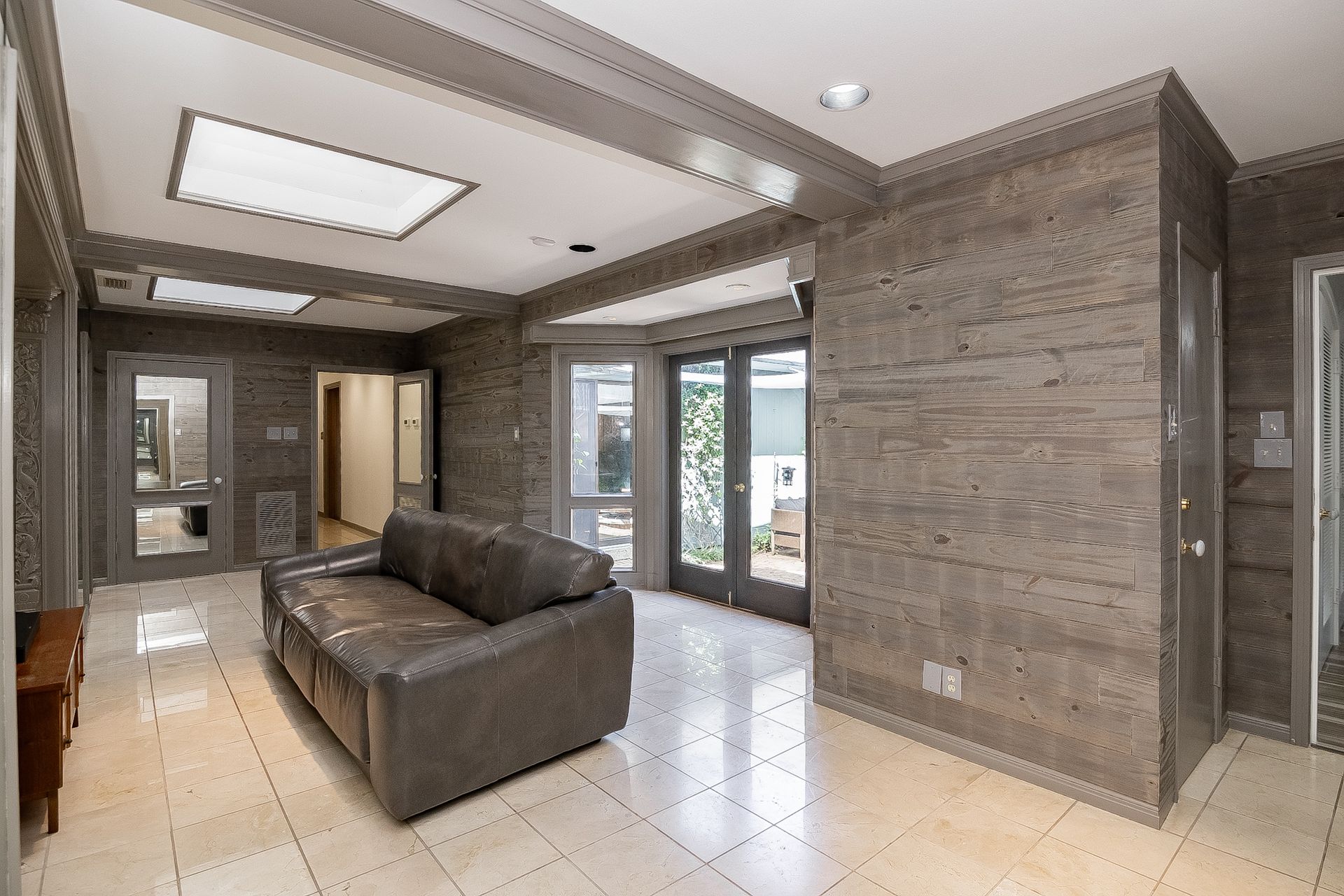 There is a couch in the middle of the room.