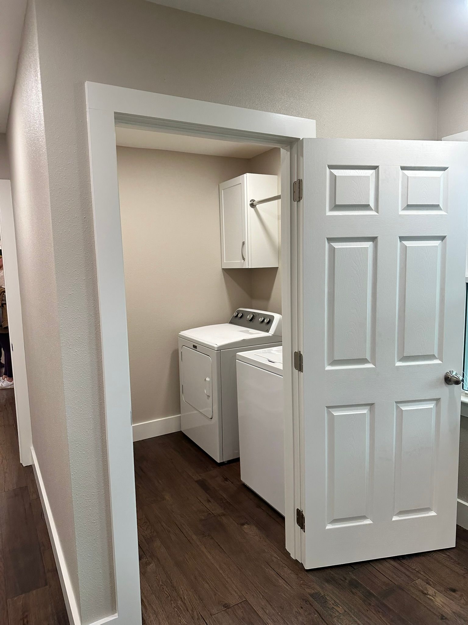 A laundry room with a washer and dryer in it