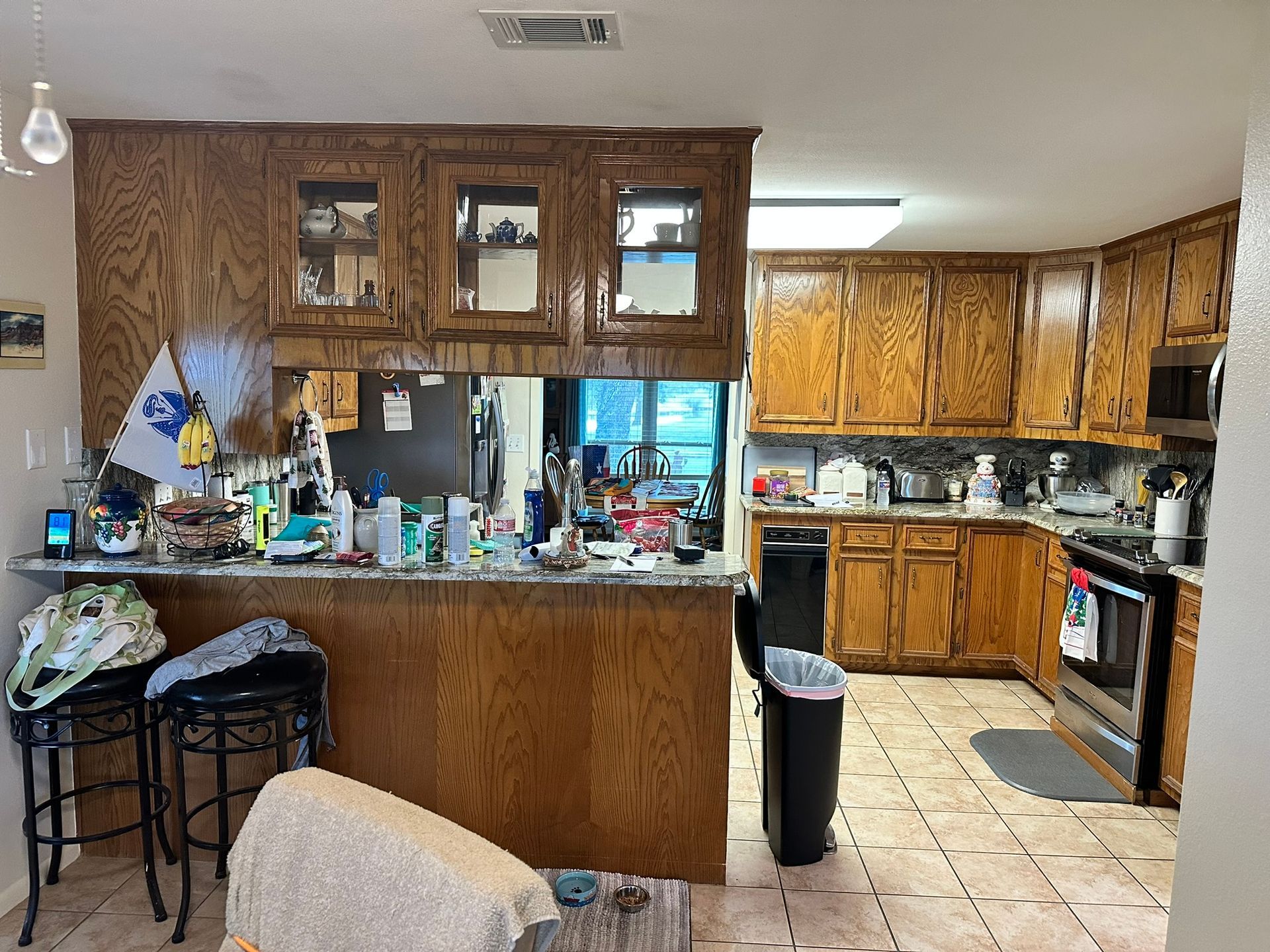A kitchen with wooden cabinets and stainless steel appliances.