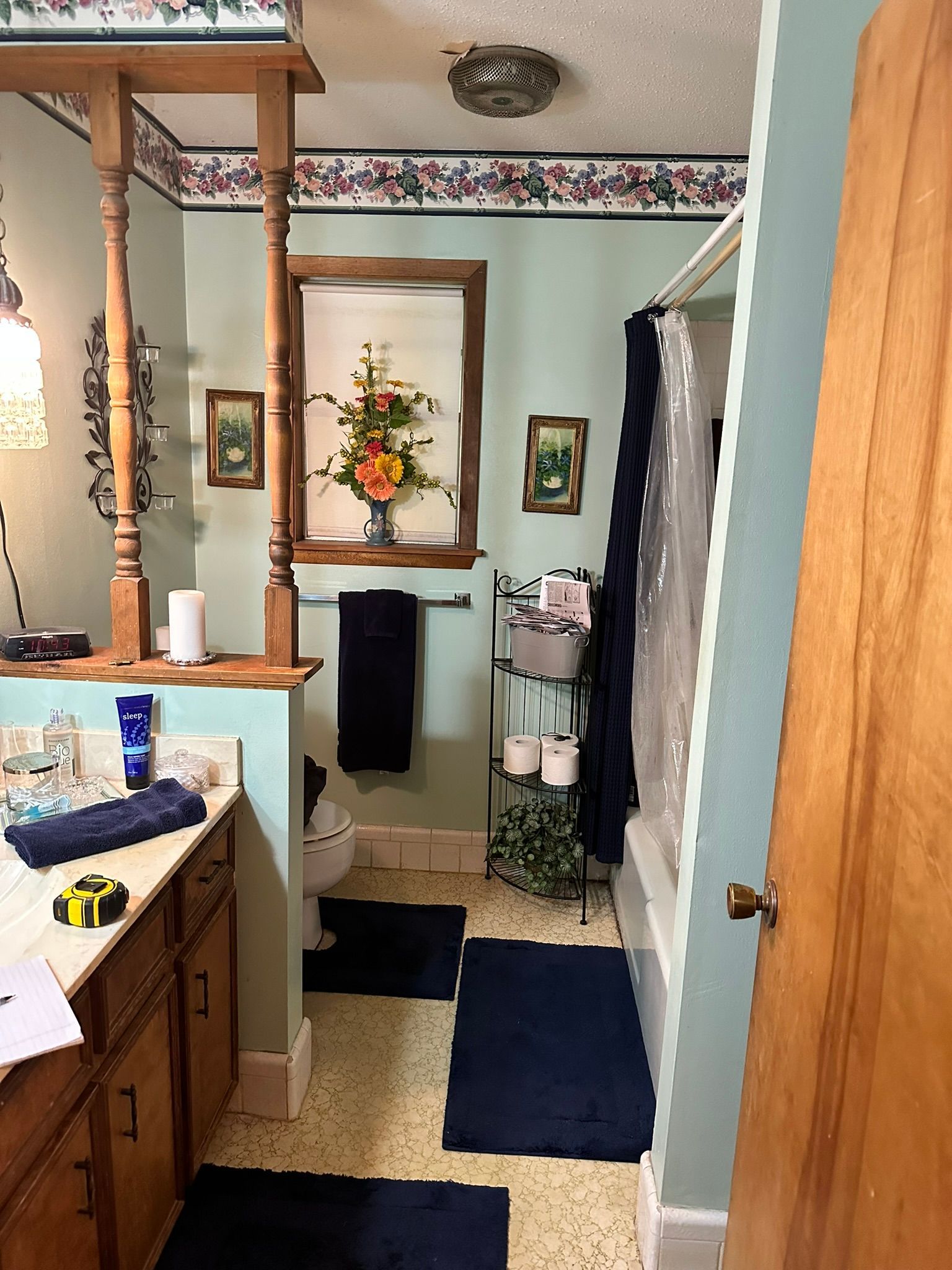 A bathroom with a sink , toilet , and shower