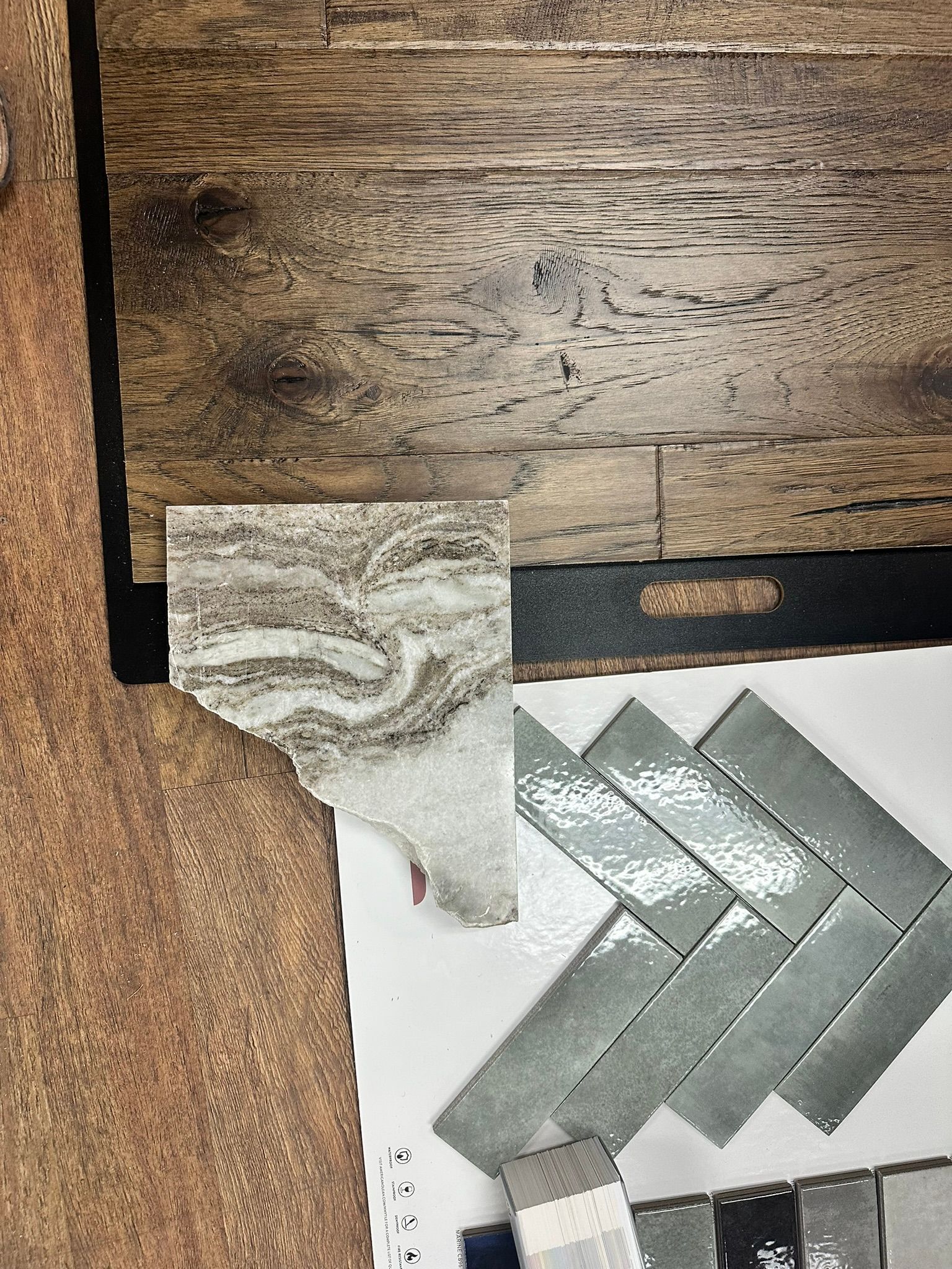 A wooden table with a bunch of tiles on it.