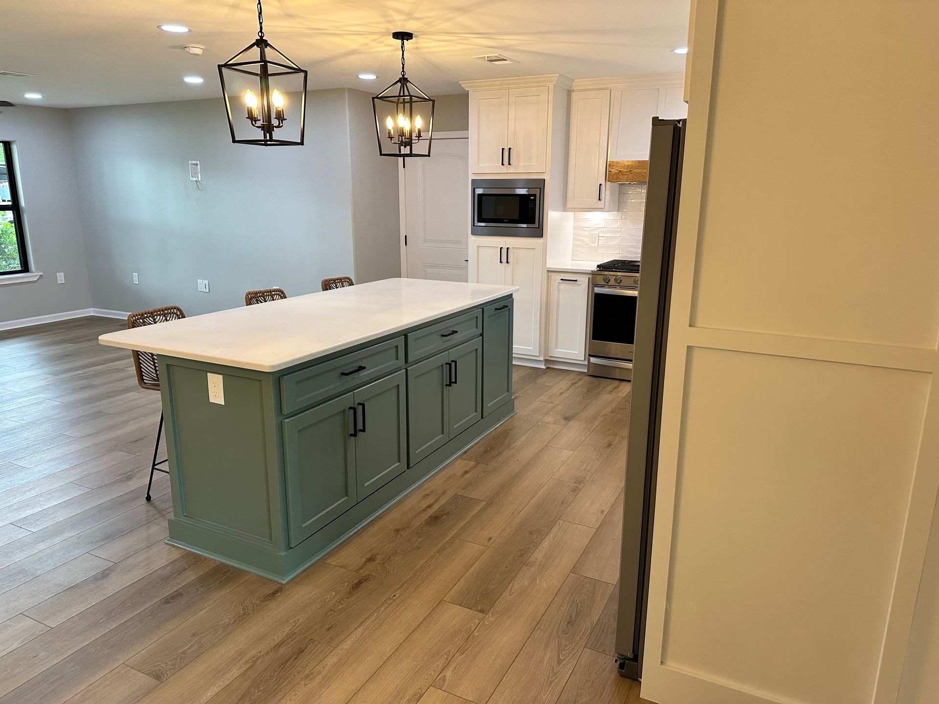 A kitchen with a large island in the middle of it.