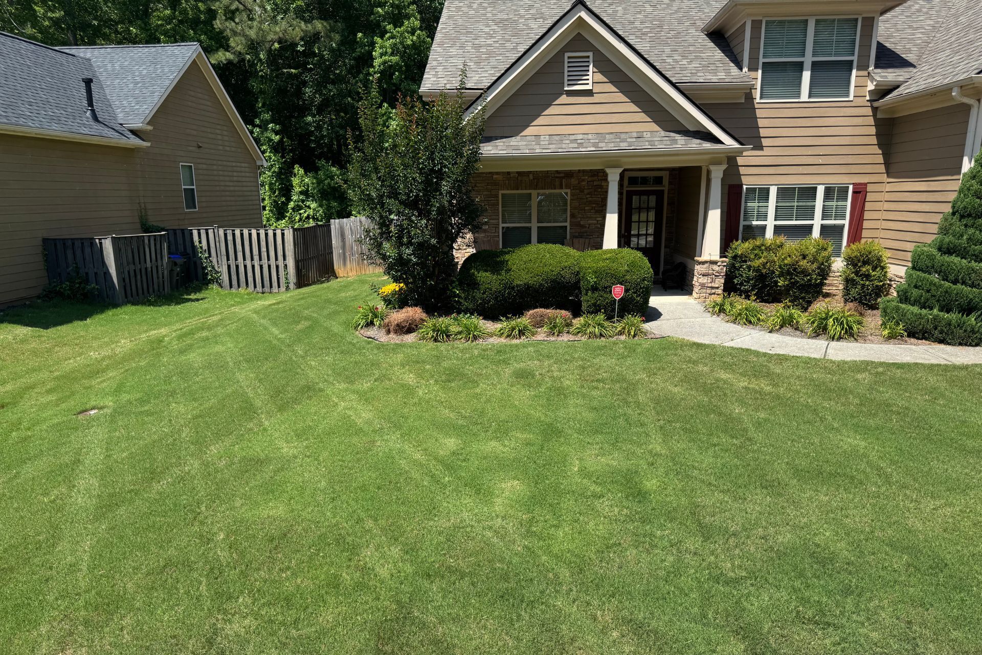 A photo of the front lawn of a house that had recently had the grass cut in Athens, GA