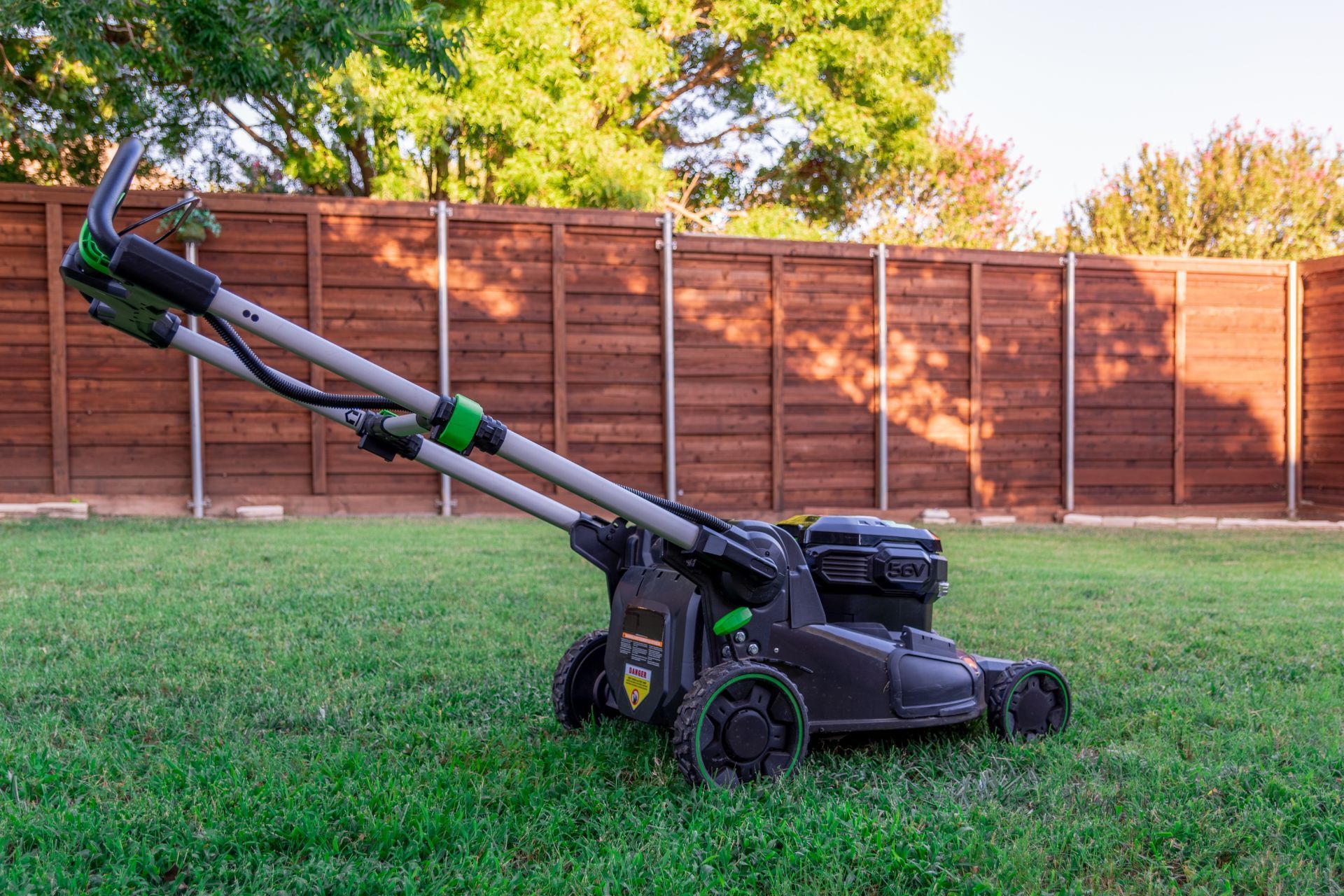 Quiet electric mower in Athens GA backyard.