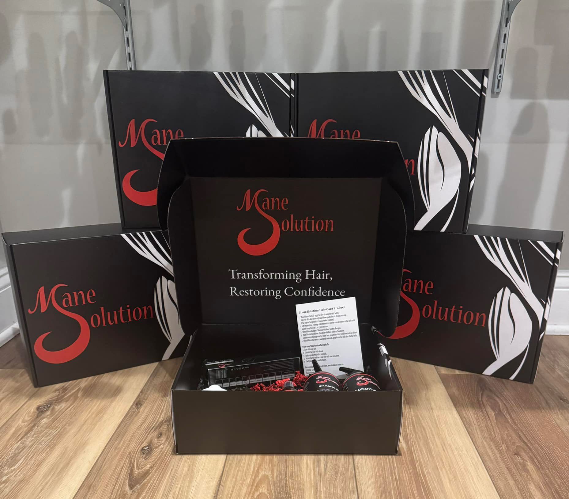 A stack of boxes with the word mane solution on them