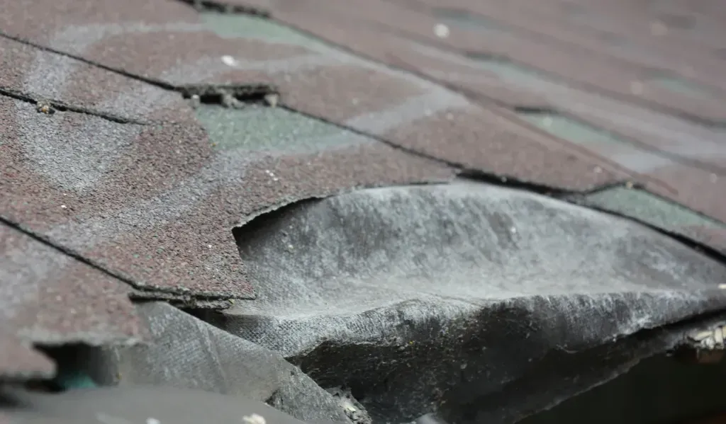 A close up of a roof with a hole in it.