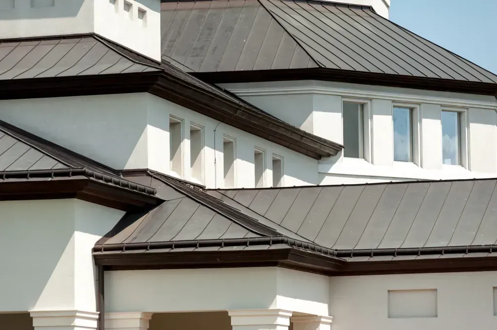 A large white building with a brown roof