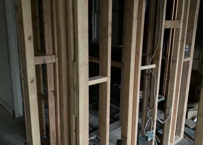 A wooden frame is being built in a room.