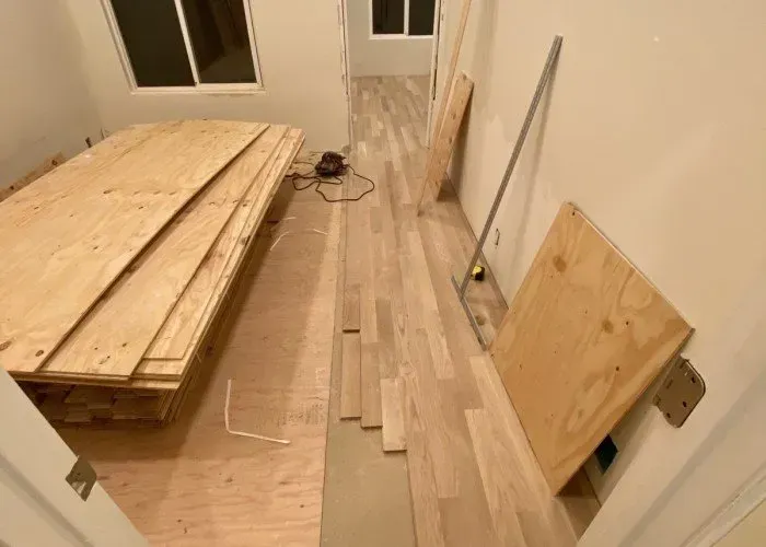 A room with a lot of wooden boards on the floor