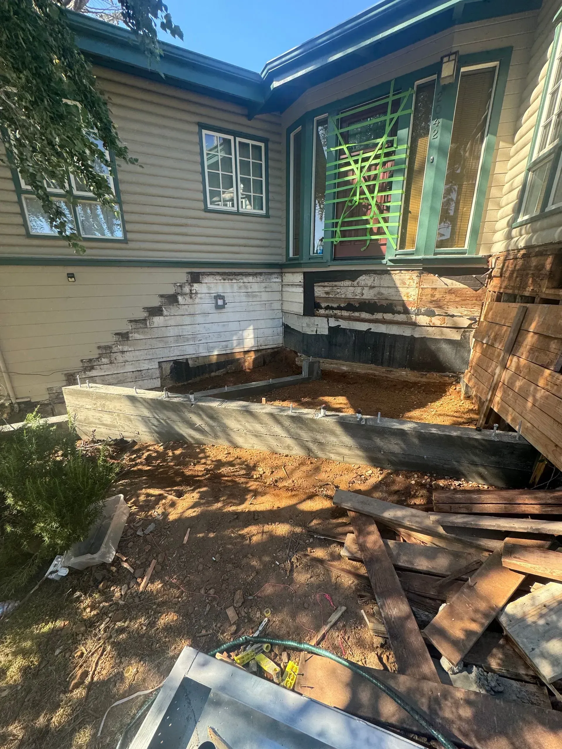 A house is being demolished and the stairs are being removed.
