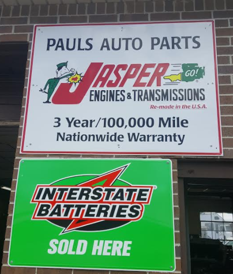 Sign for Paul's Auto Parts displaying Jasper Engines & Interstate Batteries.