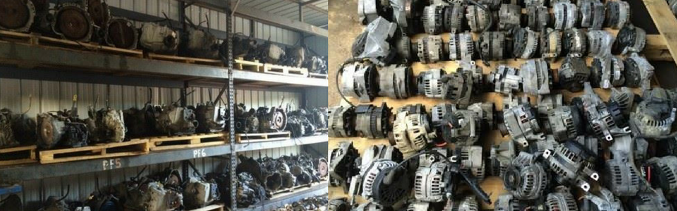 Warehouse with many car parts on shelves and in a pile.