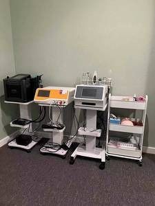 A room filled with lots of medical equipment and a printer
