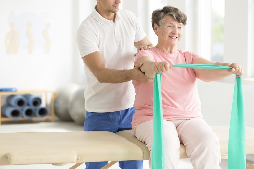 A Healthcare Professional Assists a Patient in a Clinic — Elevate Injury Management in Sandy Bay, TAS