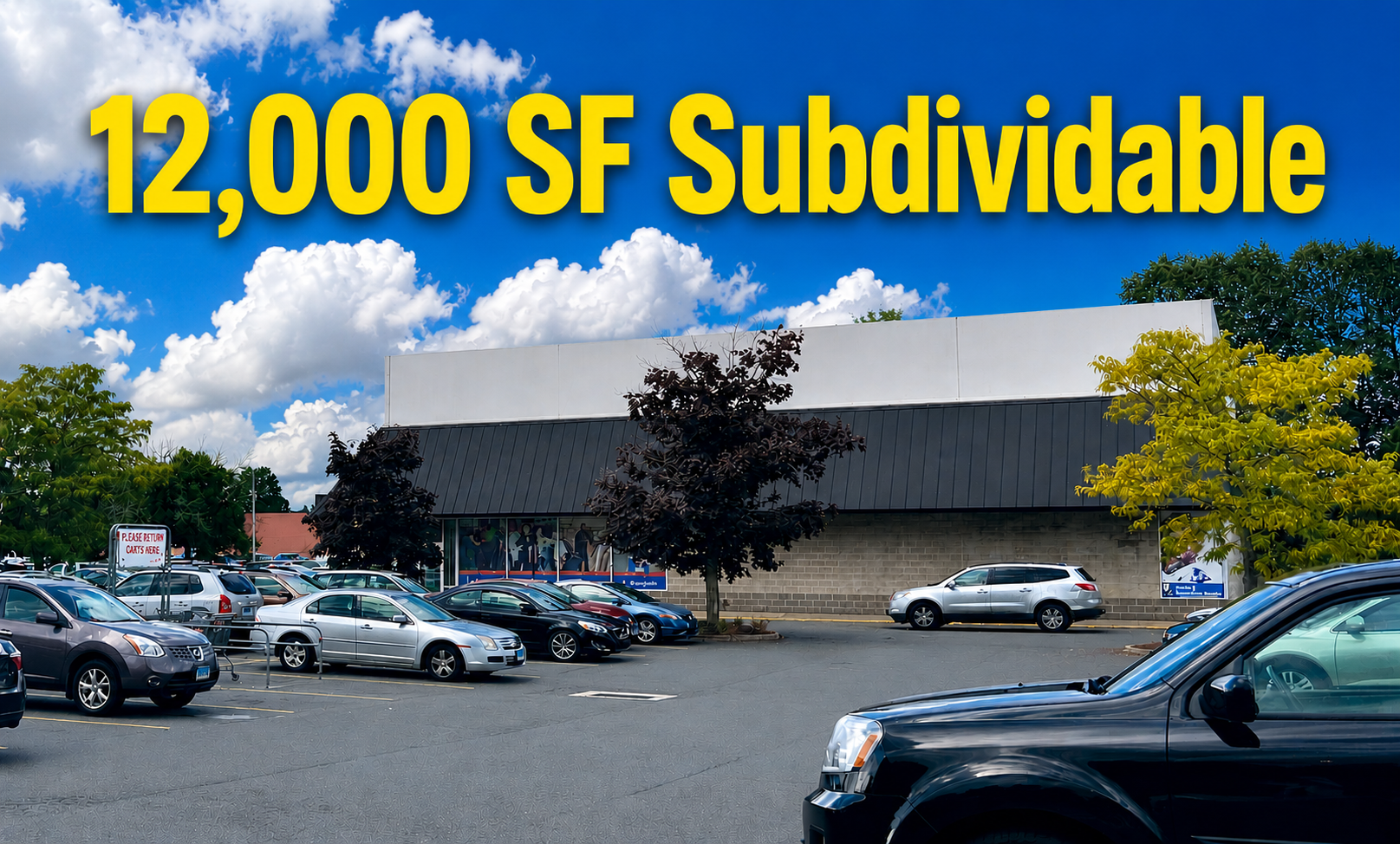 Shopping center exterior with cars in the parking lot. Stores include Ocean State Job Lot and Goodwill on a sunny day.