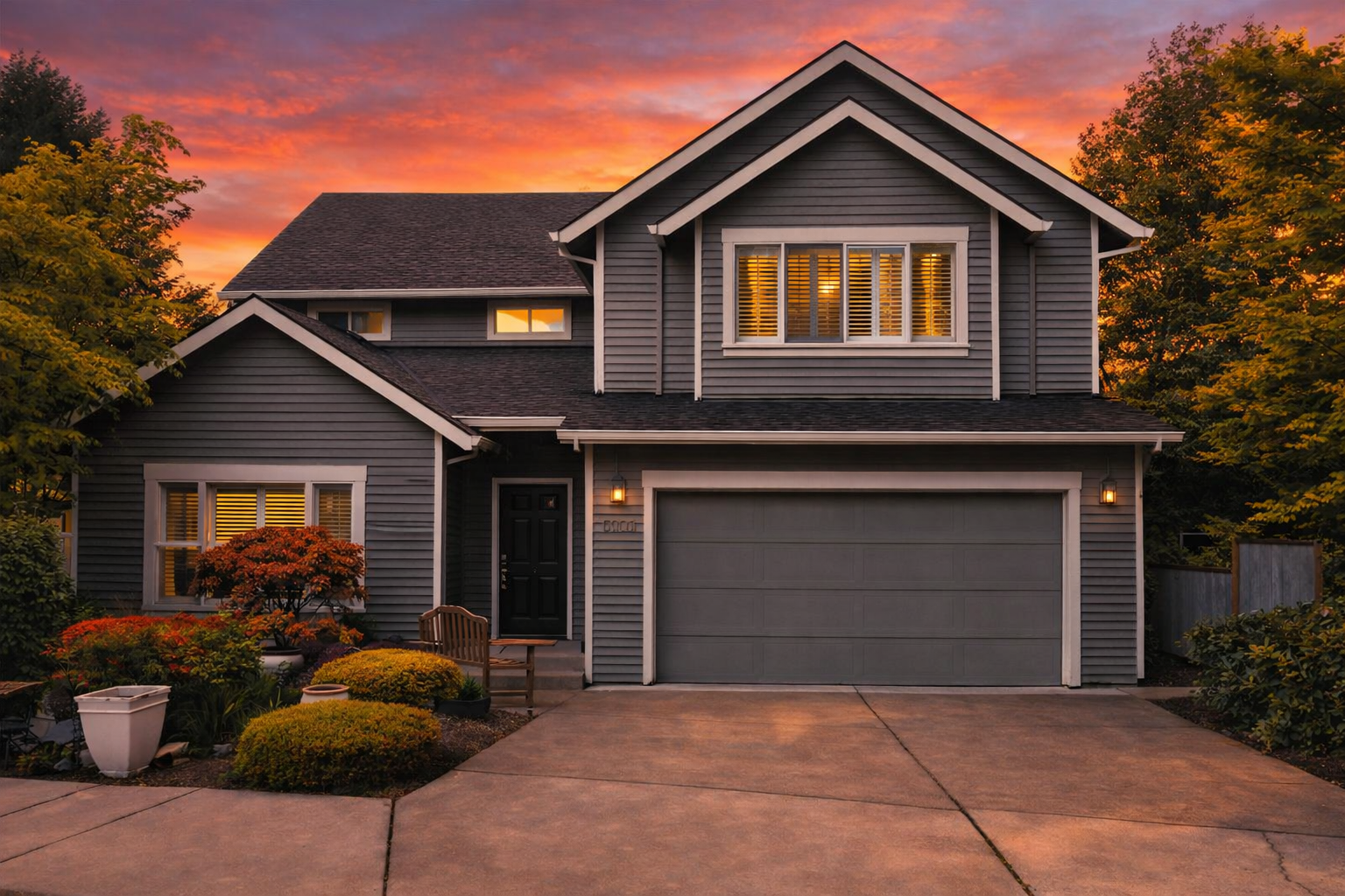 Green two-story house with a floor plan showing the layout and square footage.