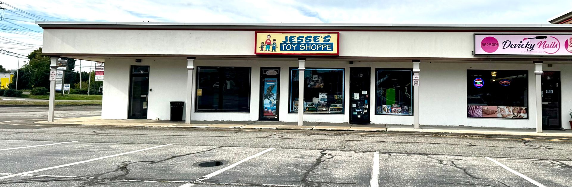 Exterior of a strip mall with a store called 