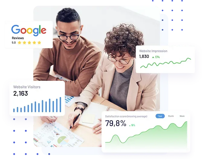 a man and a woman are sitting at a table looking at a graph .