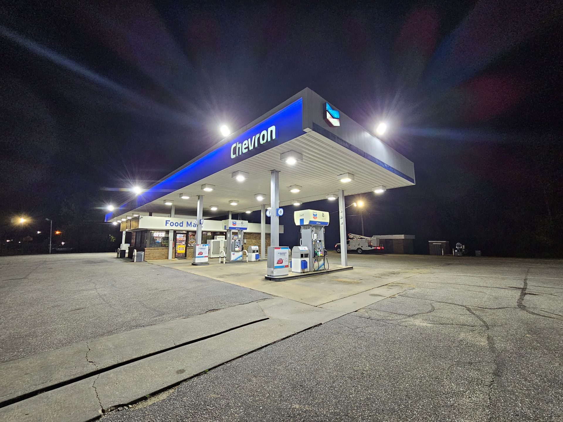 A crexton gas station is lit up at night