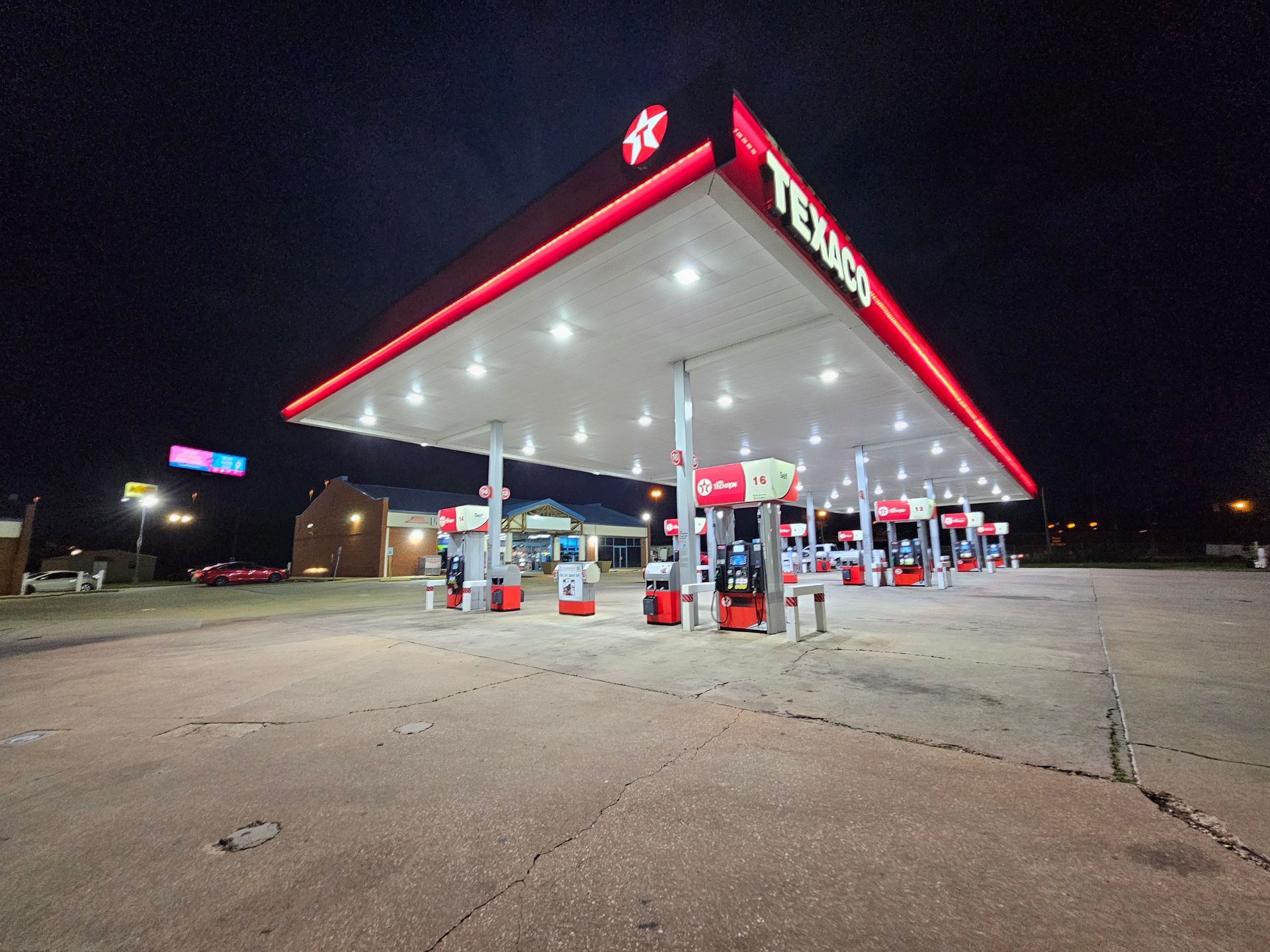 A texas gas station is lit up at night