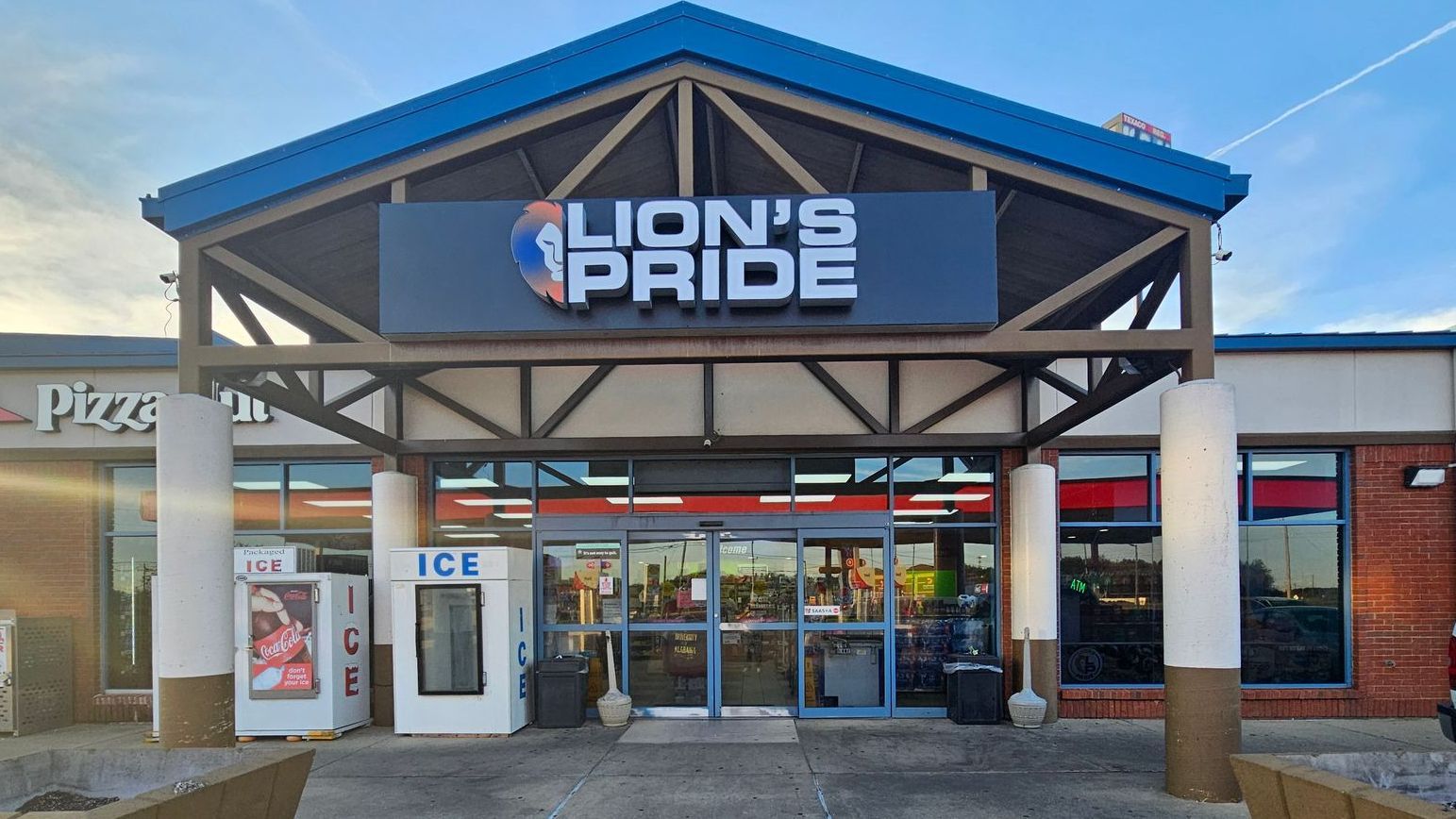 A store front with a sign that says lion 's pride on it.