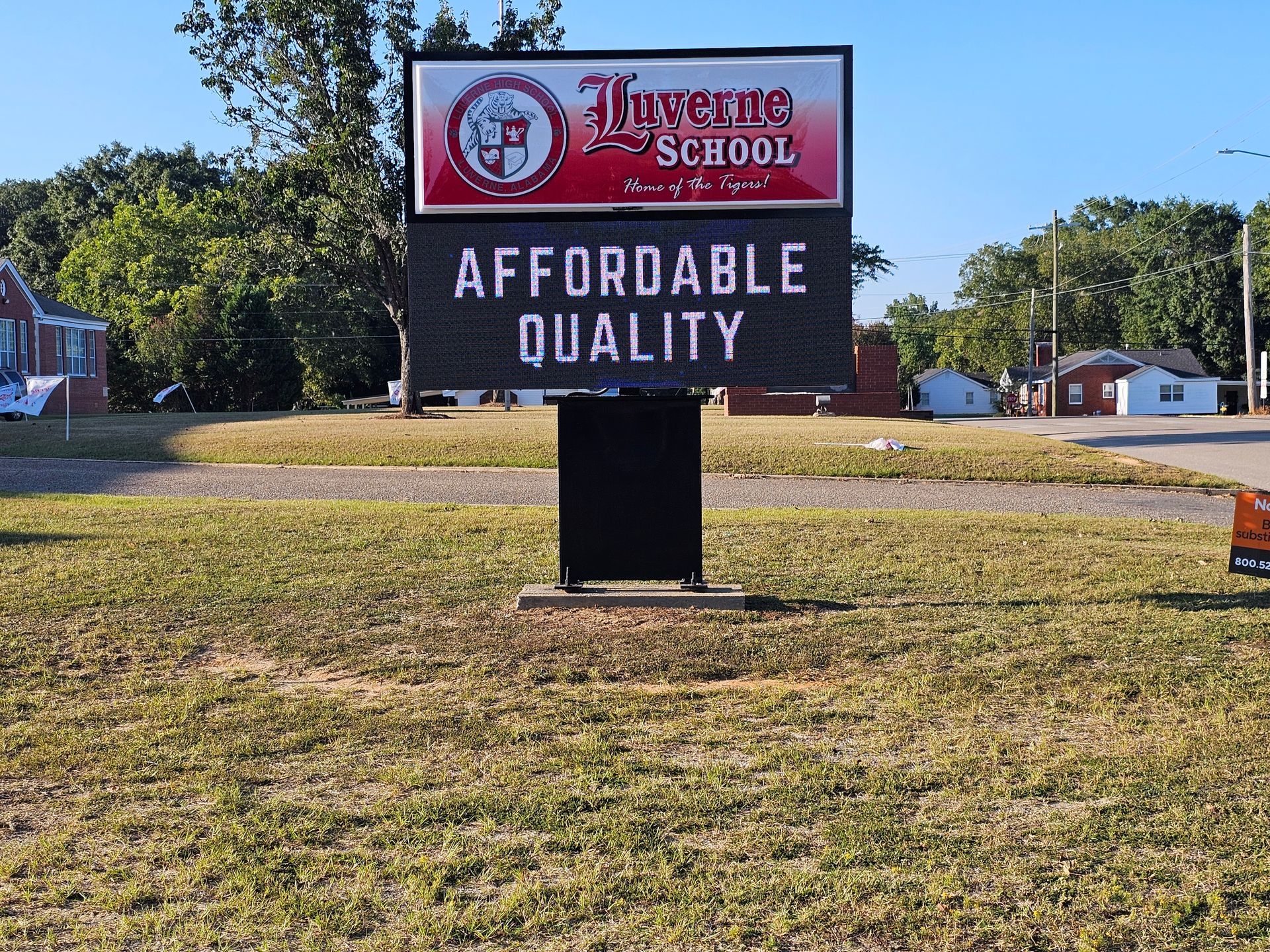 A sign for a school that says affordable quality