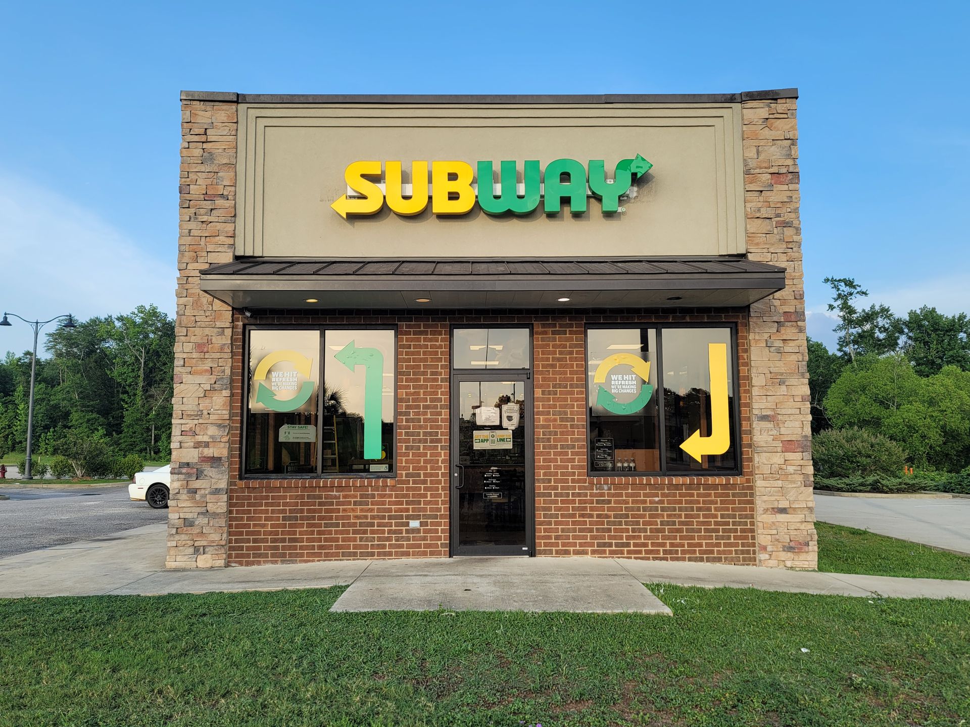 A subway restaurant is located in a brick building